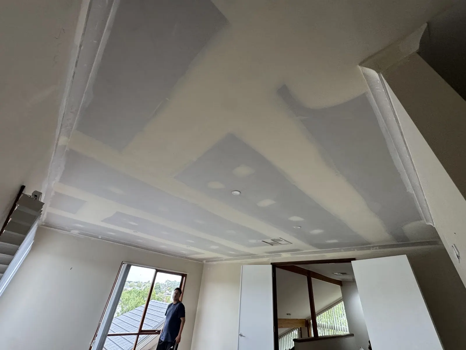 Plastered interior ready for painting, with the site left clean and tidy.