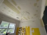 Cornice work along a freshly finished wall.